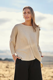Model Tegan wearing size S of the Easy Does It Knit Top in colour Natural, from the front, showing the whole outfit
