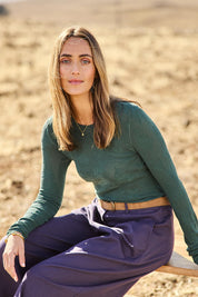 Model Tegan wearing size S of the Love Layer Long Sleeve Knit Top in colour Sage (Green), from the front, showing the whole outfit