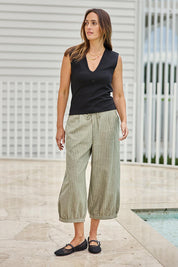 Model Tegand wearing size 10 of the Summer Daze Striped Pull On 3/4 Pant – Sage in colour Sage, from the front