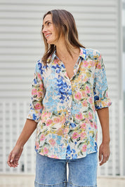 Model Tegand wearing size 10 of the Garden Glory Tab Sleeve Shirt – Bluefleur in colour Bluefleur, from an angle