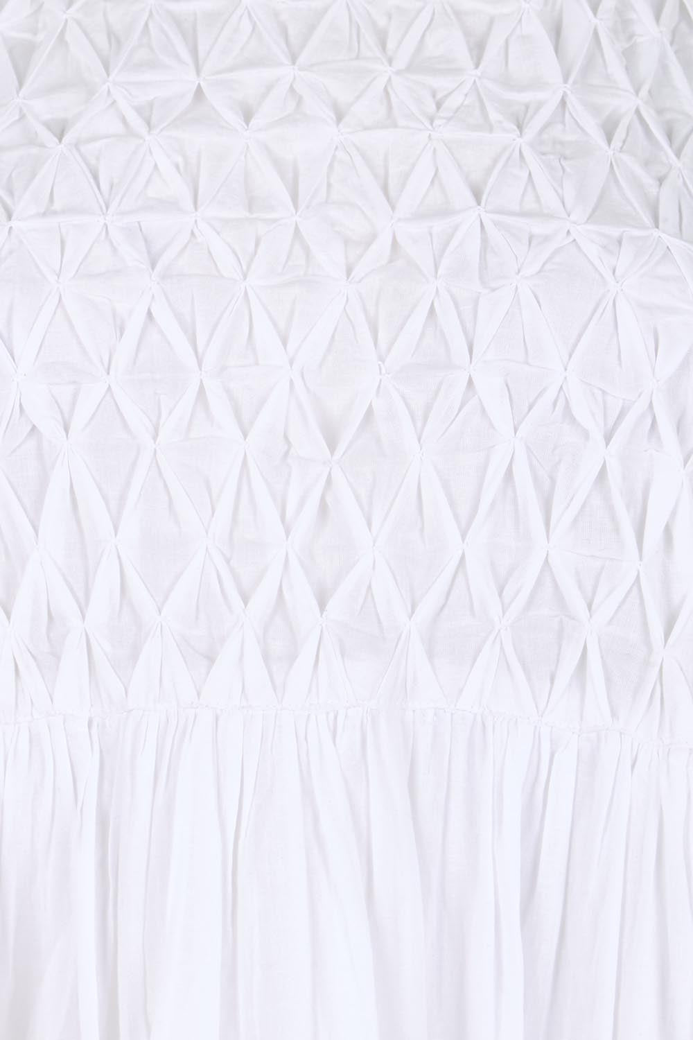 Product shot of the Summer Breeze Smocked Cotton Dress – White in colour White, showing detail