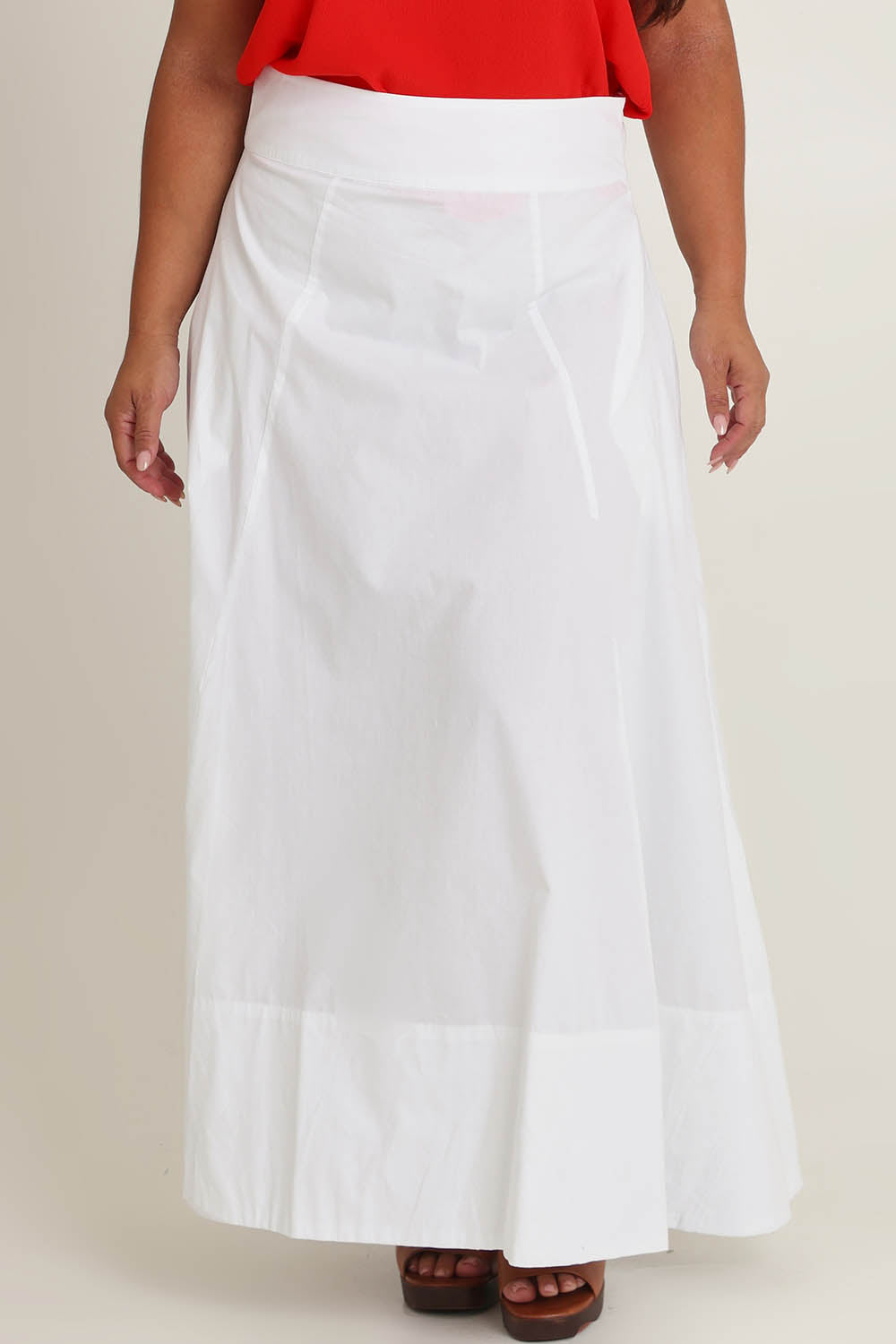 Model Ashleigh wearing size 16 of the Timeless Love Cotton Maxi Skirt in colour White (White), from the front, cropped image