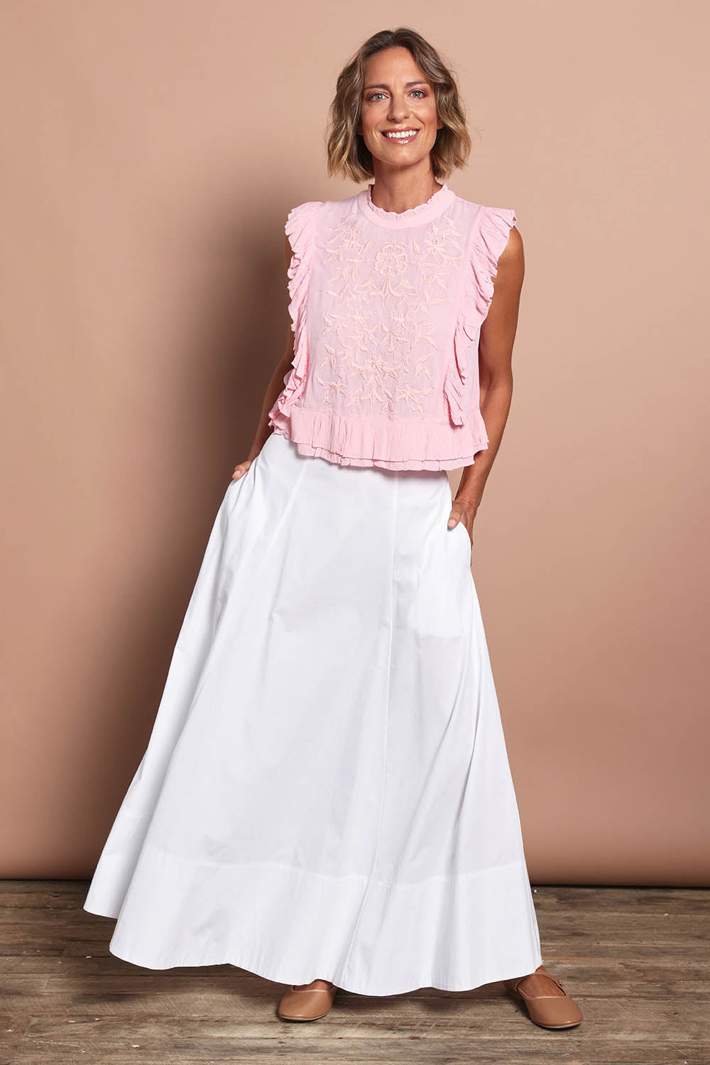 Model Riina wearing size 10 of the Timeless Love Cotton Maxi Skirt in colour White (White), from the front, showing the whole outfit