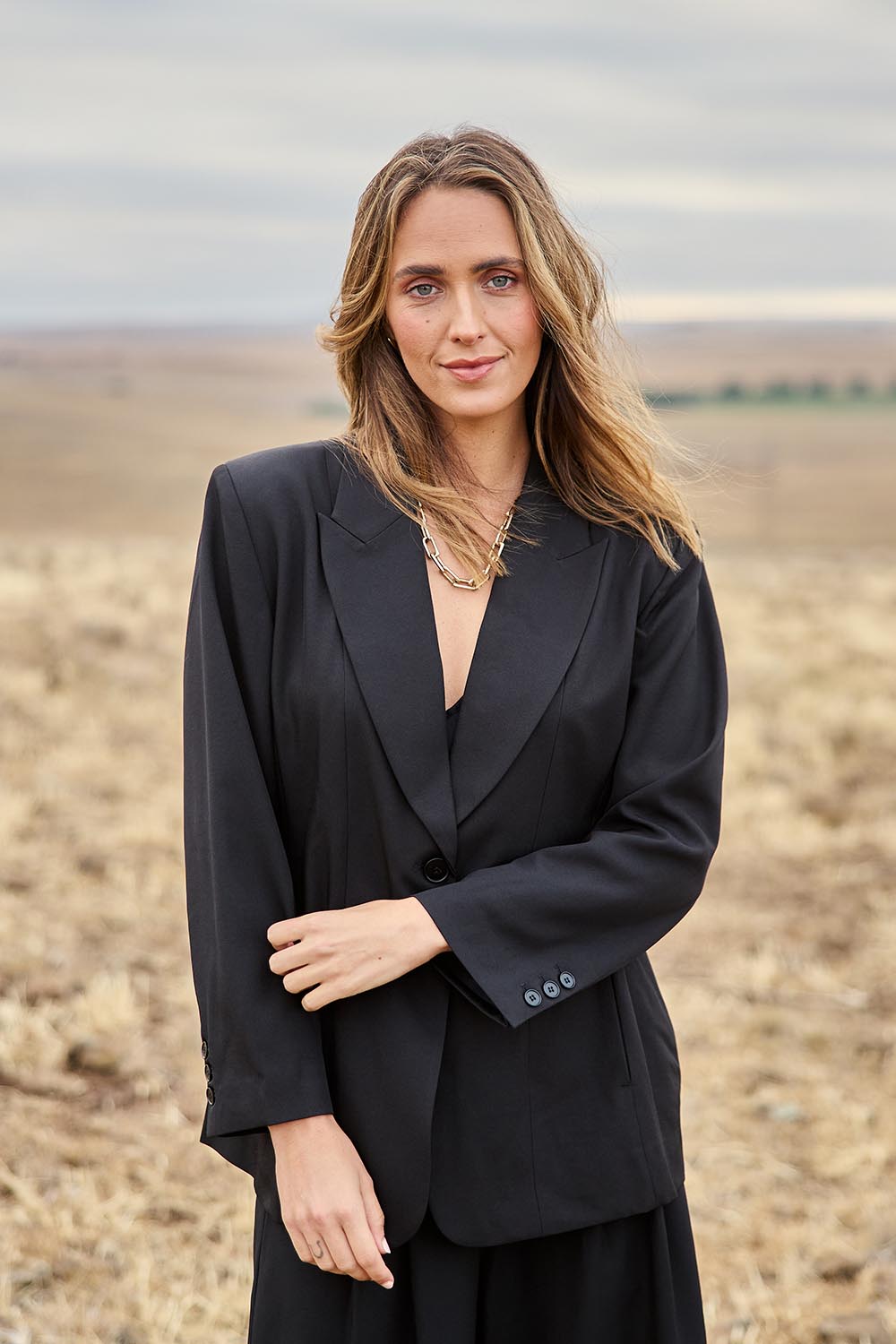 Model Tegan wearing size 10 of the All The Right Moves Blazer in colour Black (Black), from the front, showing the whole outfit
