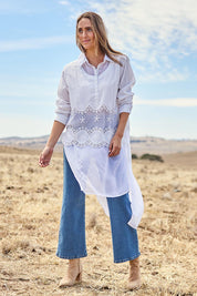 Model Cara wearing size 10 of the My Sweetheart Longline Shirt in colour White (White), from the front, showing the whole outfit