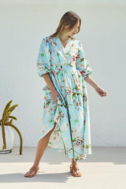 Model Tegand wearing size 10 of the Walking On Sunshine Cotton Maxi Wrap Dress – Skybloom in colour Skybloom, from the front