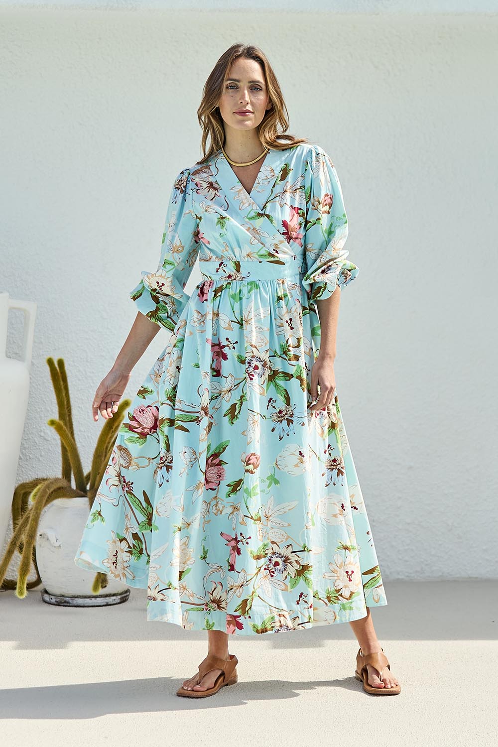 Model Tegand wearing size 10 of the Walking On Sunshine Cotton Maxi Wrap Dress – Skybloom in colour Skybloom, from the front