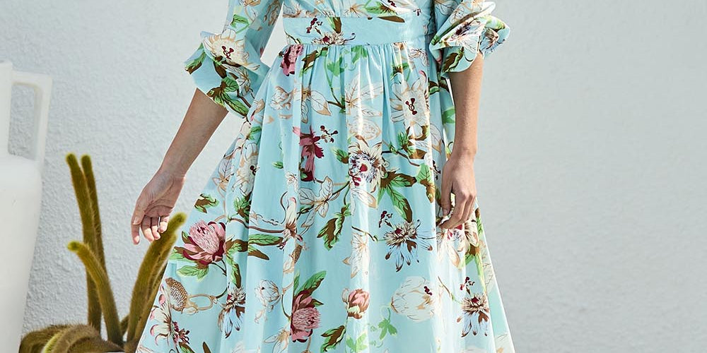 Model Tegand wearing size 10 of the Walking On Sunshine Cotton Maxi Wrap Dress – Skybloom in colour Skybloom, from the front