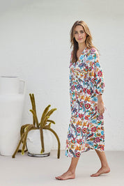 Model Tegand wearing size 10 of the Bright Bird Cotton Poplin Wrap Dress – Birdgarden in colour Birdgarden, from the front