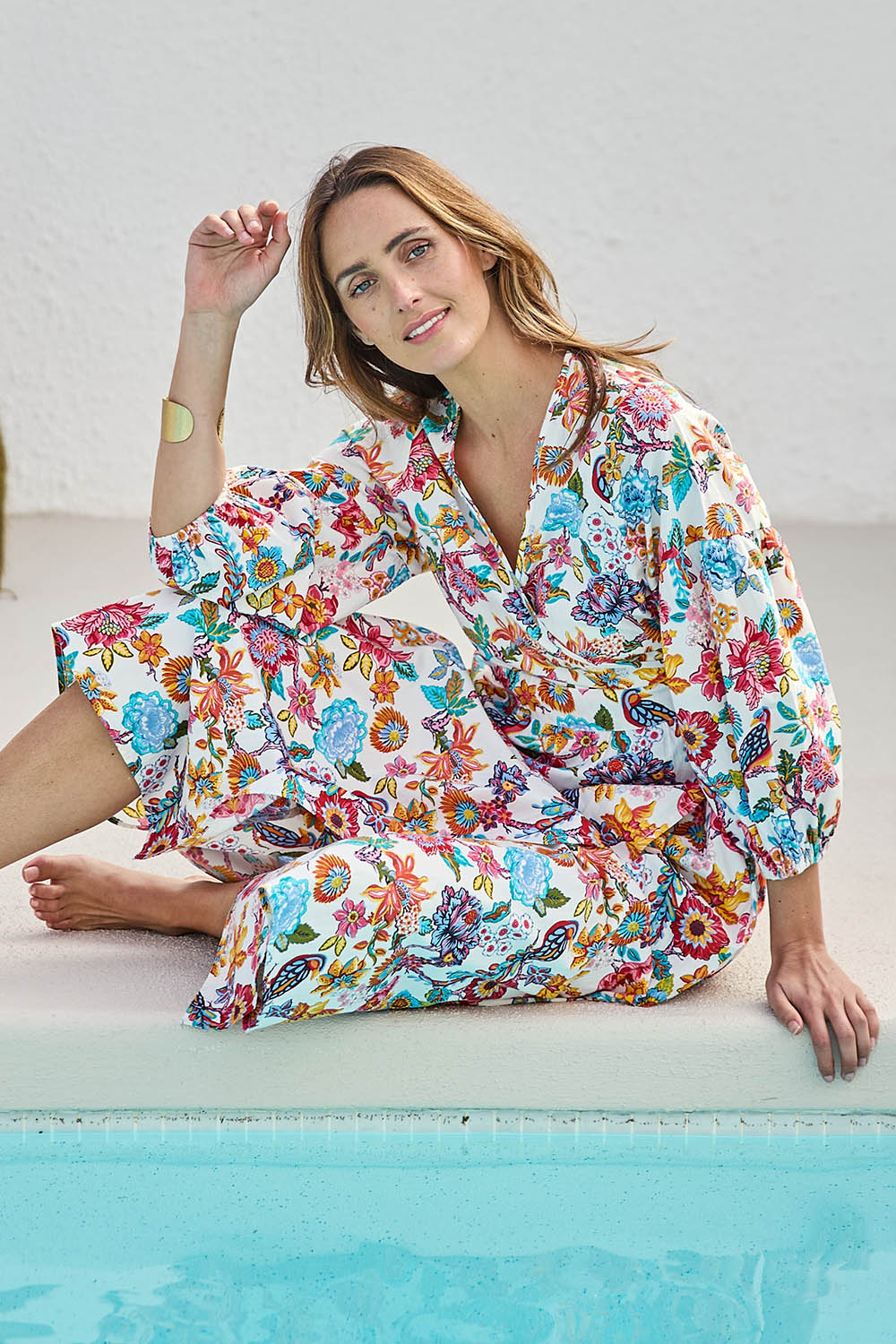 Model Tegand wearing size 10 of the Bright Bird Cotton Poplin Wrap Dress – Birdgarden in colour Birdgarden, from the front