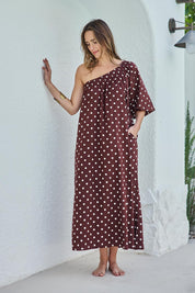 Model Tegand wearing size 10 of the Spotted You One Shoulder Cotton Maxi – Chocolate in colour Chocolate, from the front