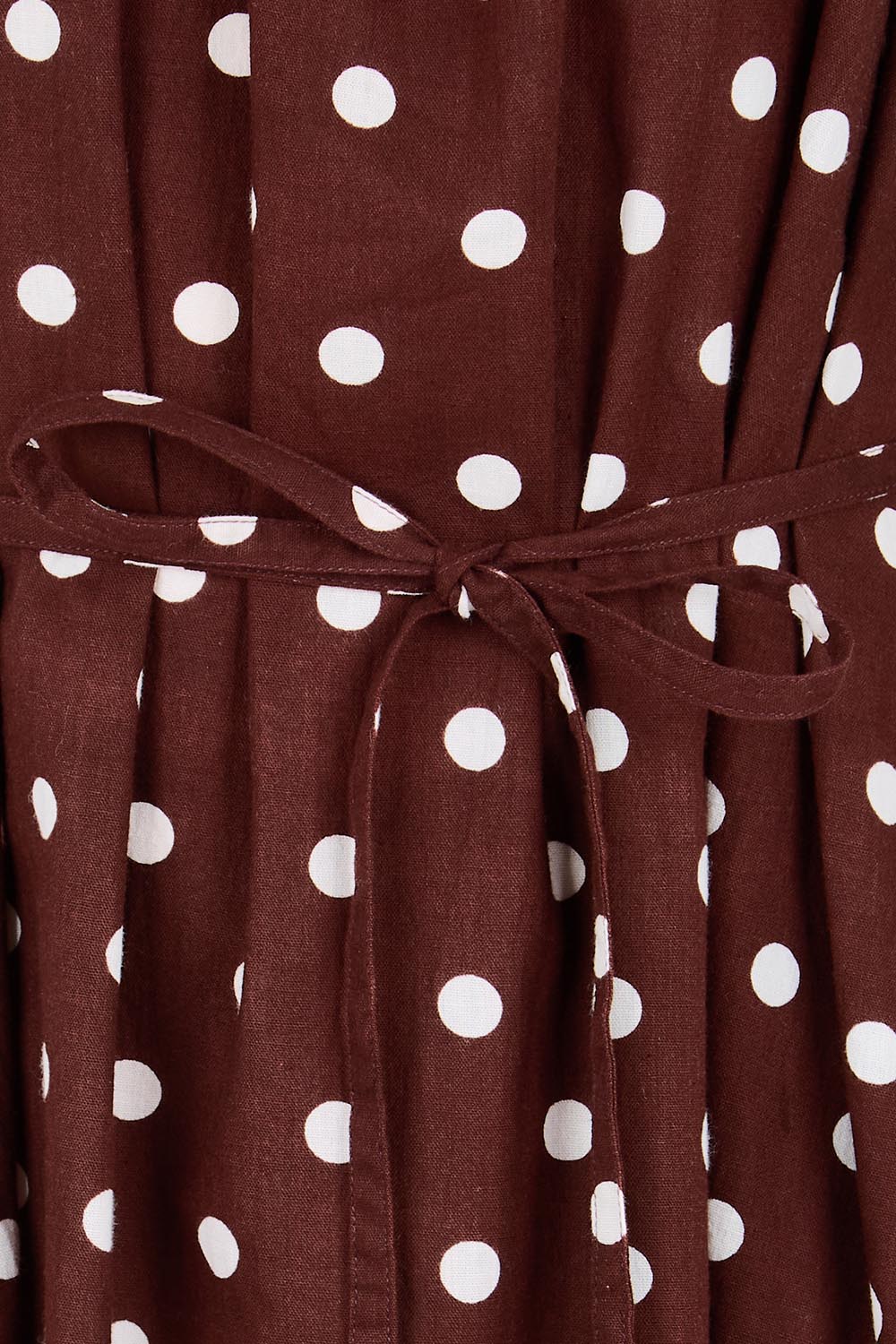 Product shot of the Spotted You One Shoulder Cotton Maxi – Chocolate in colour Chocolate, showing detail