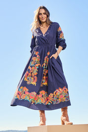 Model Tegand wearing size 10 of the When Im With My Folk Cotton Dress – Navyfleur in colour Navyfleur, from the front
