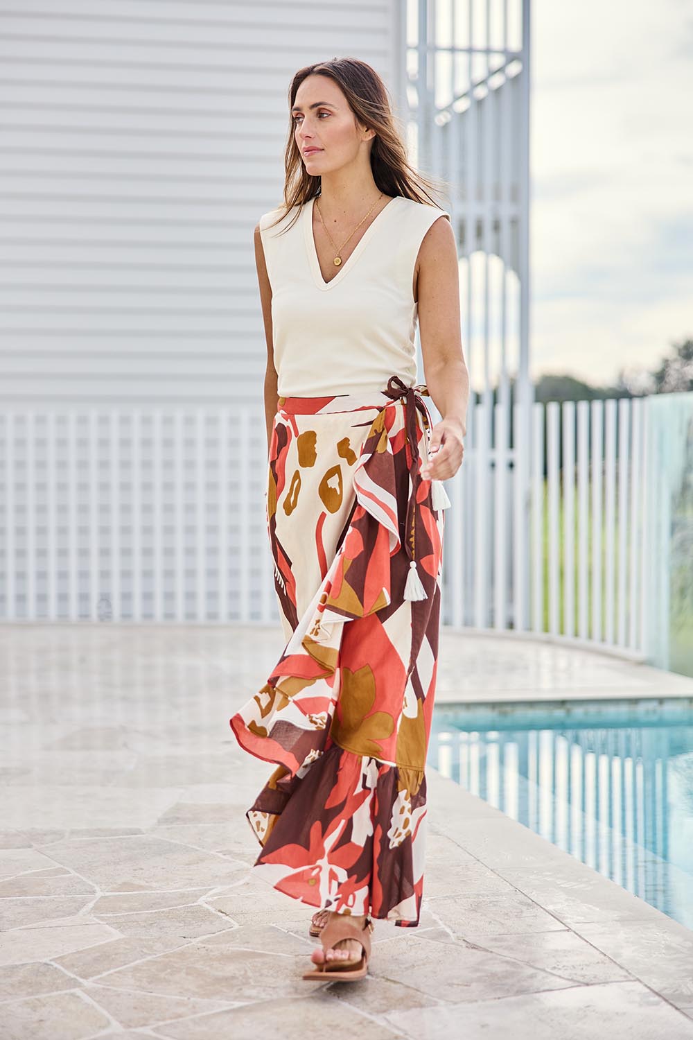 Model Tegand wearing size 10 of the Wrap Me With Love Cotton Maxi Skirt – Garden in colour Garden, from the front