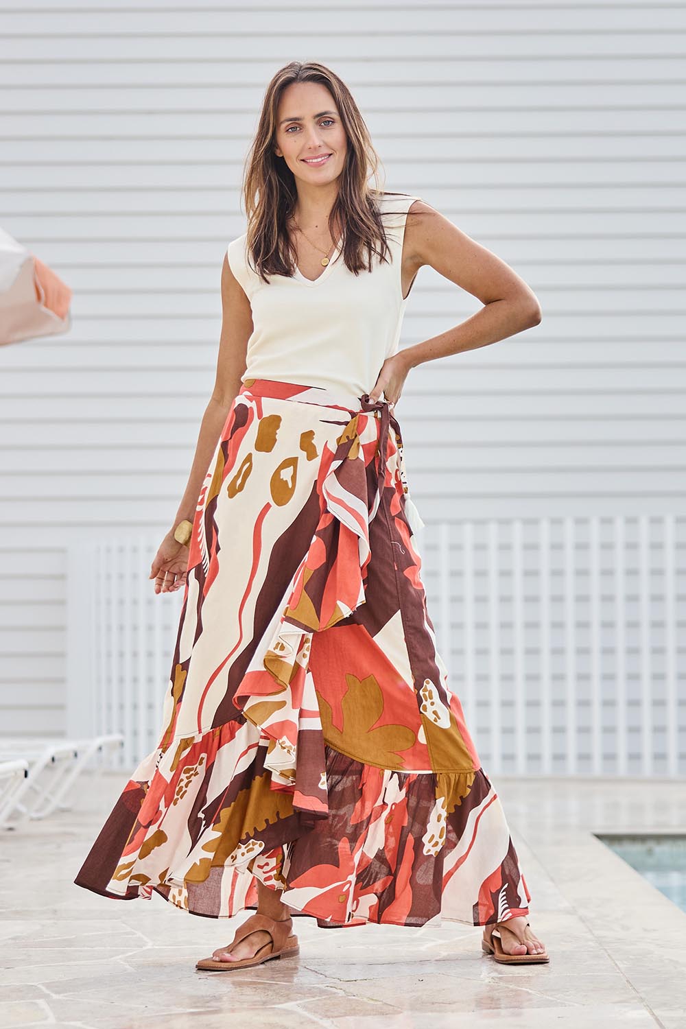 Model Tegand wearing size 10 of the Wrap Me With Love Cotton Maxi Skirt – Garden in colour Garden, from the front