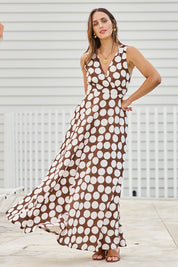 Model Tegand wearing size 10 of the Cocktails And Gardens Cotton Maxi Dress – Chocspot in colour Chocspot, from the front