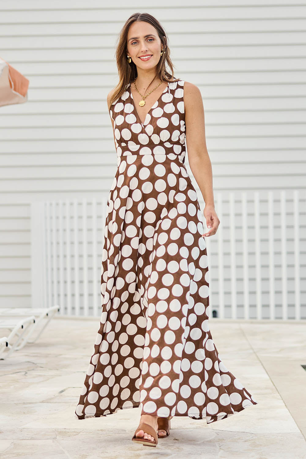 Model Tegand wearing size 10 of the Cocktails And Gardens Cotton Maxi Dress – Chocspot in colour Chocspot, from the front