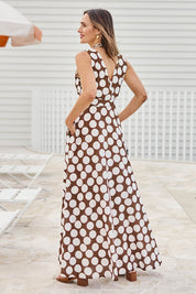 Model Tegand wearing size 10 of the Cocktails And Gardens Cotton Maxi Dress – Chocspot in colour Chocspot, from the front