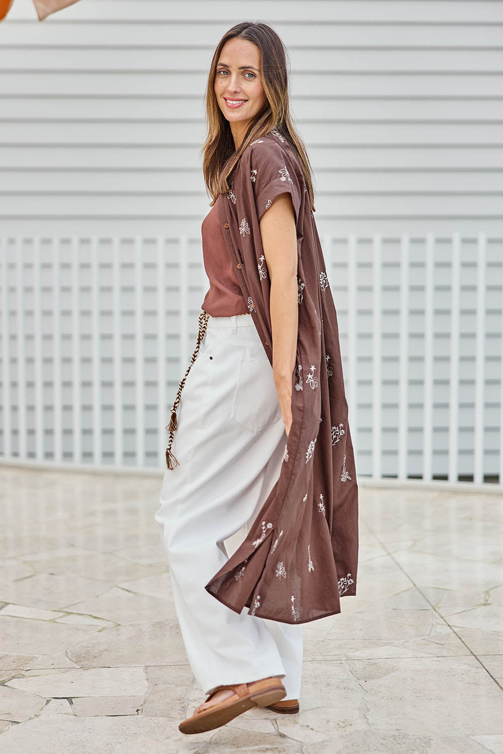 Model Tegand wearing size 10 of the Wildflower Embroidered Cotton Tunic Dress – Chocolate in colour Chocolate, from the front