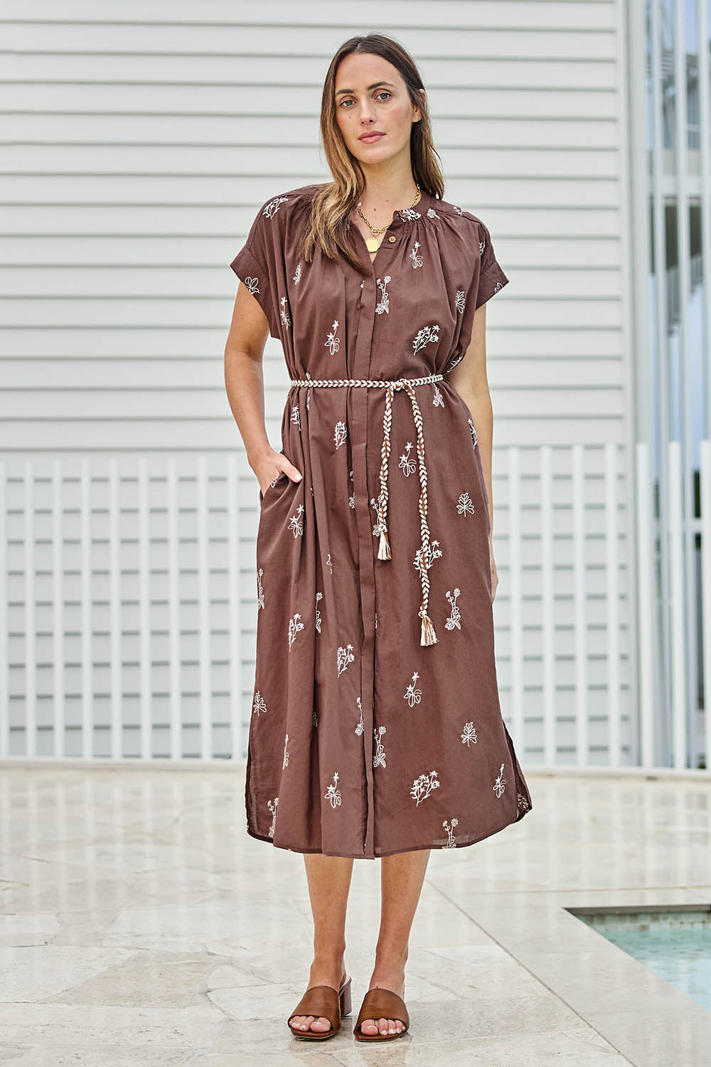 Model Tegand wearing size 10 of the Wildflower Embroidered Cotton Tunic Dress – Chocolate in colour Chocolate, from the front