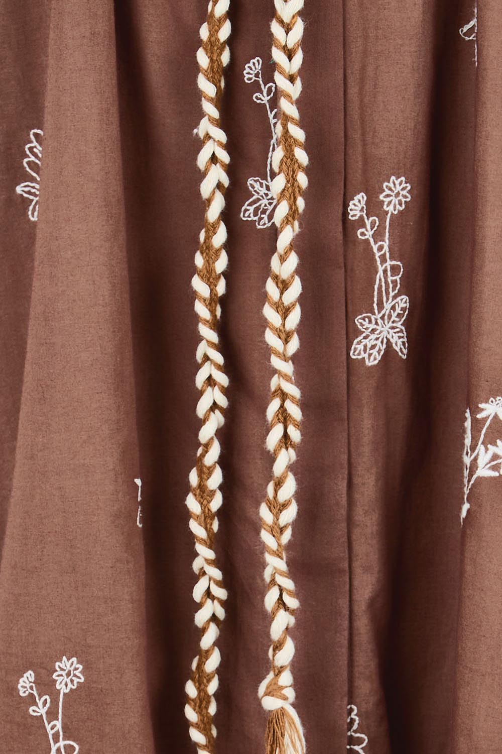 Product shot of the Wildflower Embroidered Cotton Tunic Dress – Chocolate in colour Chocolate, showing detail