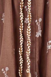 Product shot of the Wildflower Embroidered Cotton Tunic Dress – Chocolate in colour Chocolate, showing detail