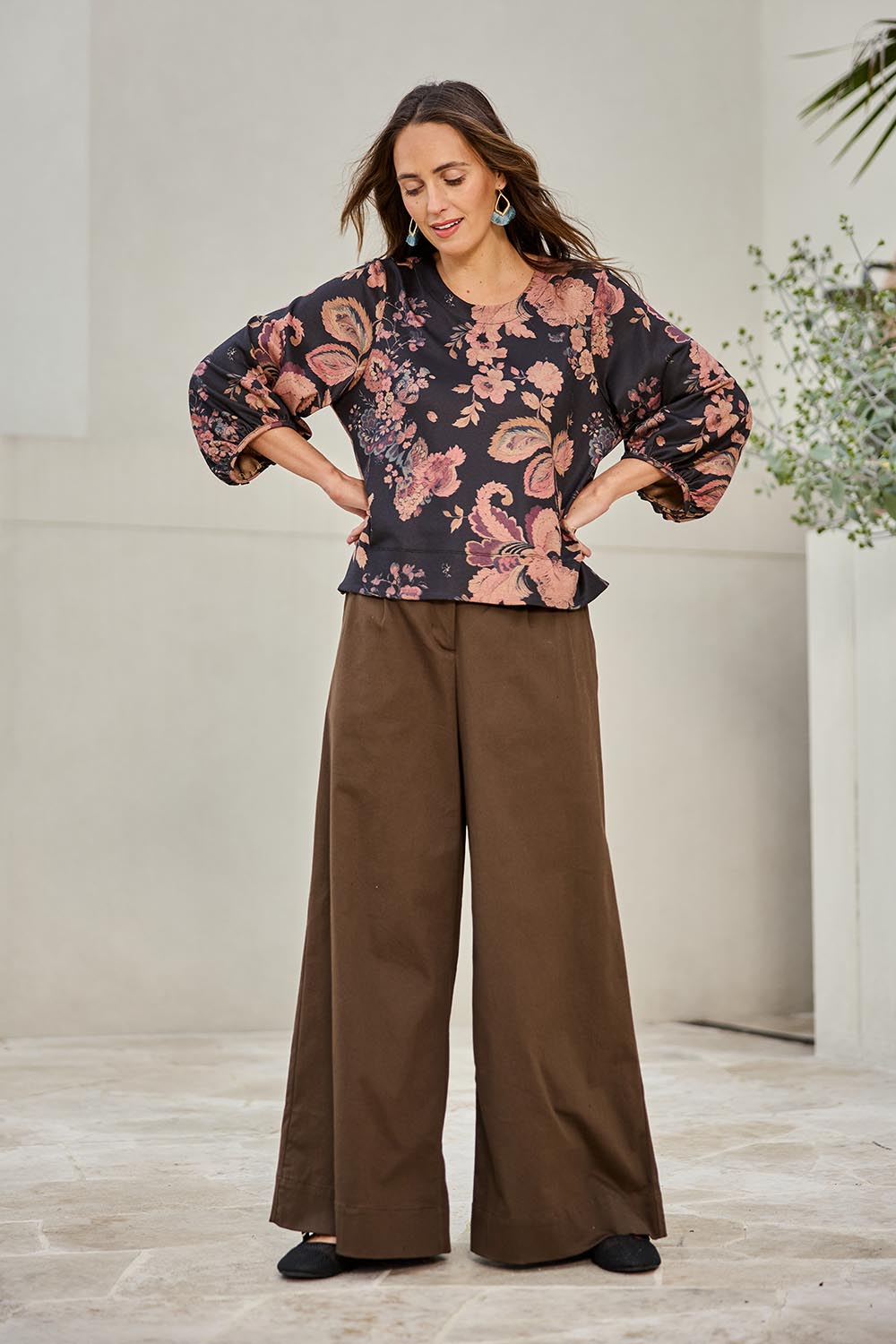 Model Tegand wearing size 10 of the Flowers For Me Balloon Sleeve Top – Blackfleur in colour Blackfleur, from the front
