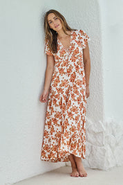 Model Tegand wearing size 10 of the Love You Bunches Maxi Dress – Blossom in colour Blossom, from the front