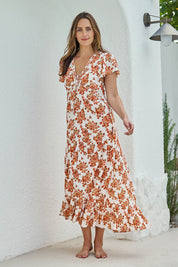 Model Tegand wearing size 10 of the Love You Bunches Maxi Dress – Blossom in colour Blossom, from the front
