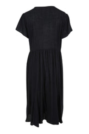 Product shot of the Cute As A Button Cotton Midi Dress – Black in colour Black, from the back