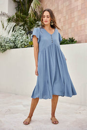 Model Tegand wearing size 10 of the Cute As A Button Cotton Midi Dress – Bluebell in colour Bluebell, from the front