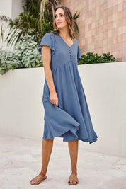 Model Tegand wearing size 10 of the Cute As A Button Cotton Midi Dress – Bluebell in colour Bluebell, from the front