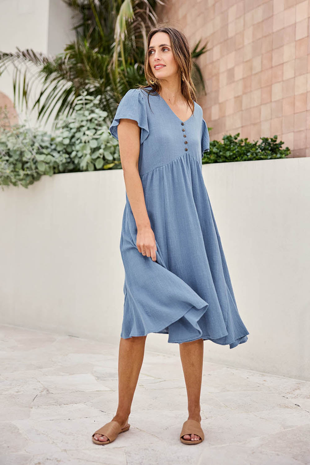 Model Tegand wearing size 10 of the Cute As A Button Cotton Midi Dress – Bluebell in colour Bluebell, from the front