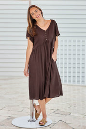 Model Tegand wearing size 10 of the Cute As A Button Cotton Midi Dress – Chocolate in colour Chocolate, from the front