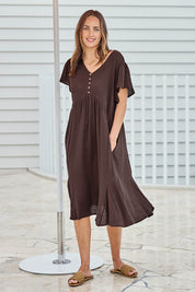 Model Tegand wearing size 10 of the Cute As A Button Cotton Midi Dress – Chocolate in colour Chocolate, from the front
