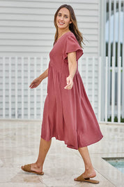 Model Tegand wearing size 10 of the Cute As A Button Cotton Midi Dress – Dustyrose in colour Dustyrose, from the front