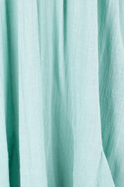 Product shot of the Cute As A Button Cotton Midi Dress – Sage in colour Sage, showing detail