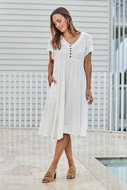Model Tegand wearing size 10 of the Cute As A Button Cotton Midi Dress – White in colour White, from the front