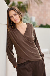 Model Tegand wearing size 10 of the Cross My Heart Sweater – Chocolate in colour Chocolate, from an angle