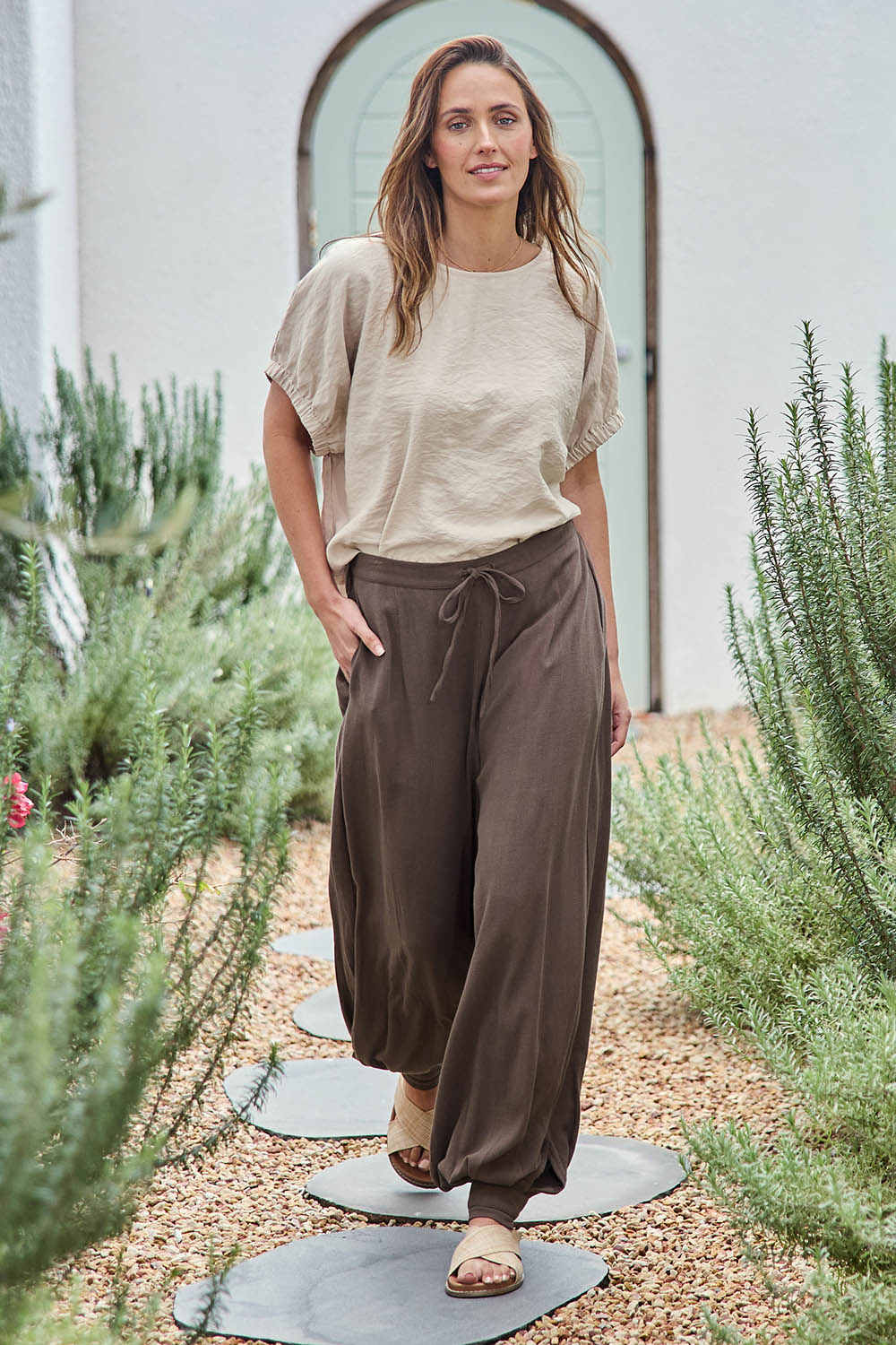 Model Tegand wearing size 10 of the All Day Pull On Balloon Pants - Milkchoc in colour Milkchoc, from the front