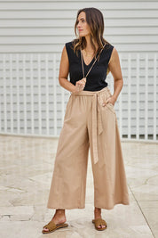 Model Tegand wearing size 10 of the Take Me Anywhere Linen Cotton Wide Leg Pants – Wheat in colour Wheat, from the front