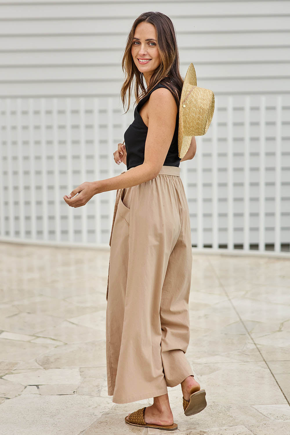 Model Tegand wearing size 10 of the Take Me Anywhere Linen Cotton Wide Leg Pants – Wheat in colour Wheat, from the front