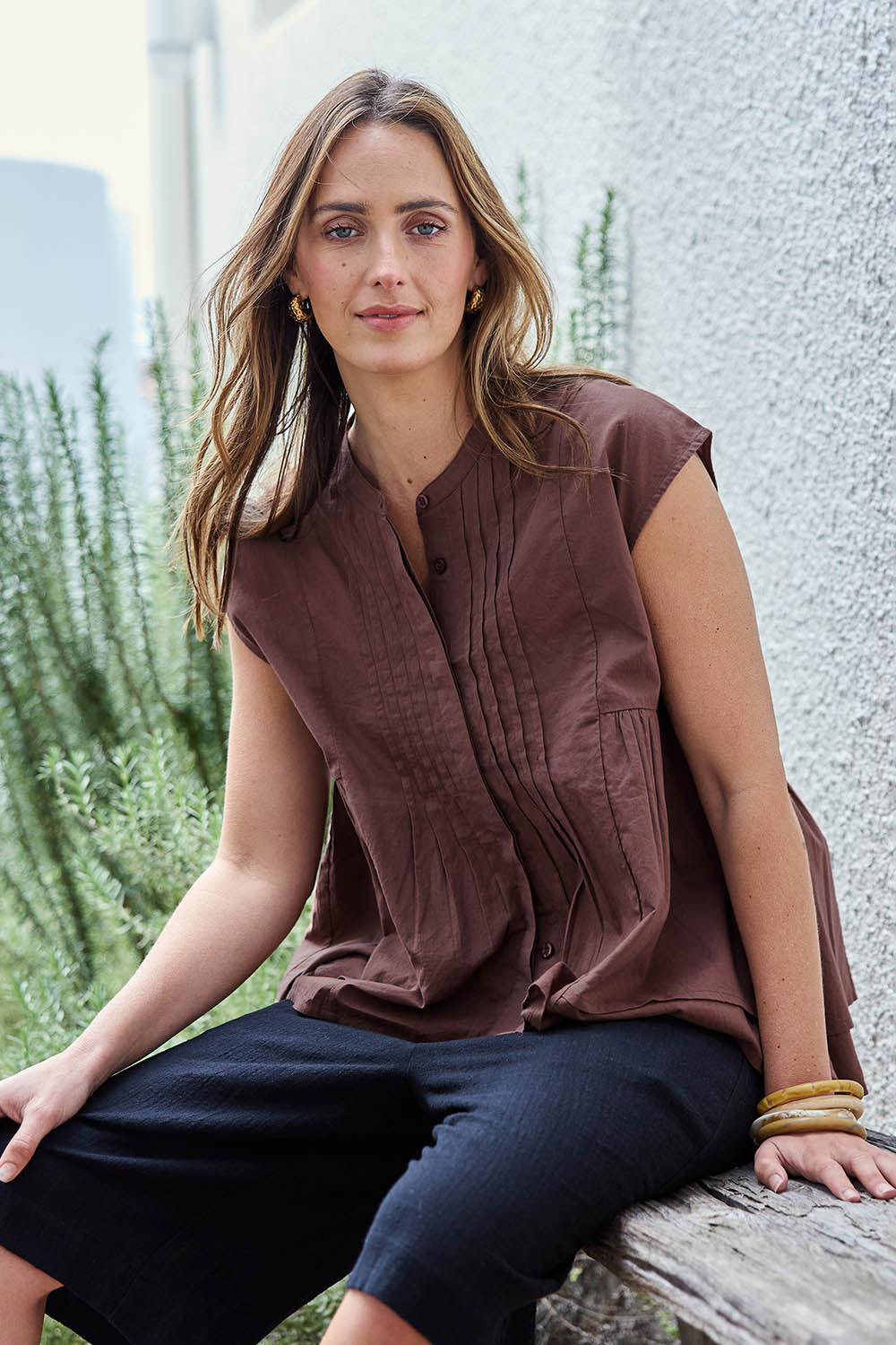Model Tegand wearing size 10 of the Easy Love Pintuck Cotton Blouse – Chocolate in colour Chocolate, in a cropped view