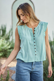 Model Tegand wearing size 10 of the Cute As A Button Fringed Tank – Mint in colour Mint, in a cropped view