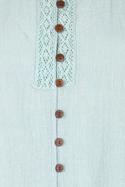 Product shot of the Cute As A Button Fringed Tank – Mint in colour Mint, showing detail