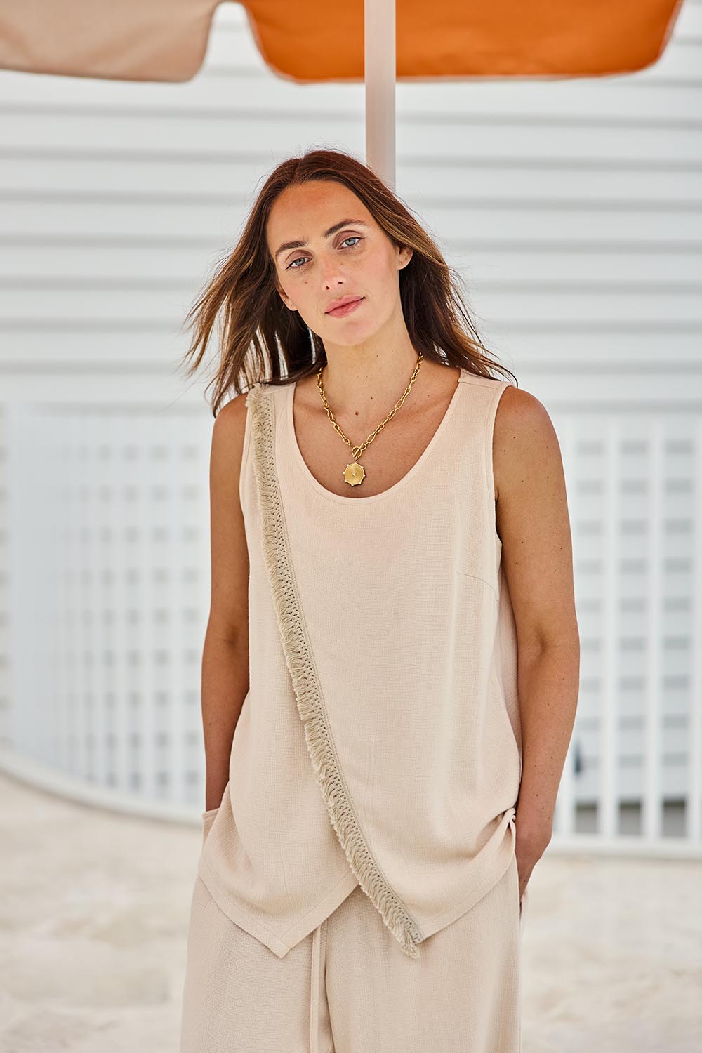 Model Tegand wearing size 10 of the Summer Daze Linen Blend Knit Tank – Sand in colour Sand, in a cropped view