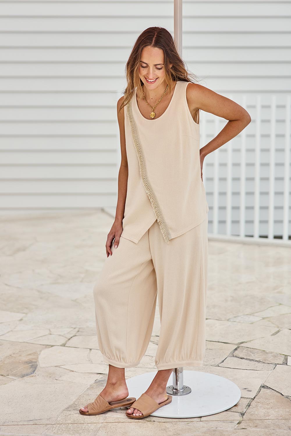 Model Tegand wearing size 10 of the Summer Daze Linen Blend Knit Tank – Sand in colour Sand, from the front