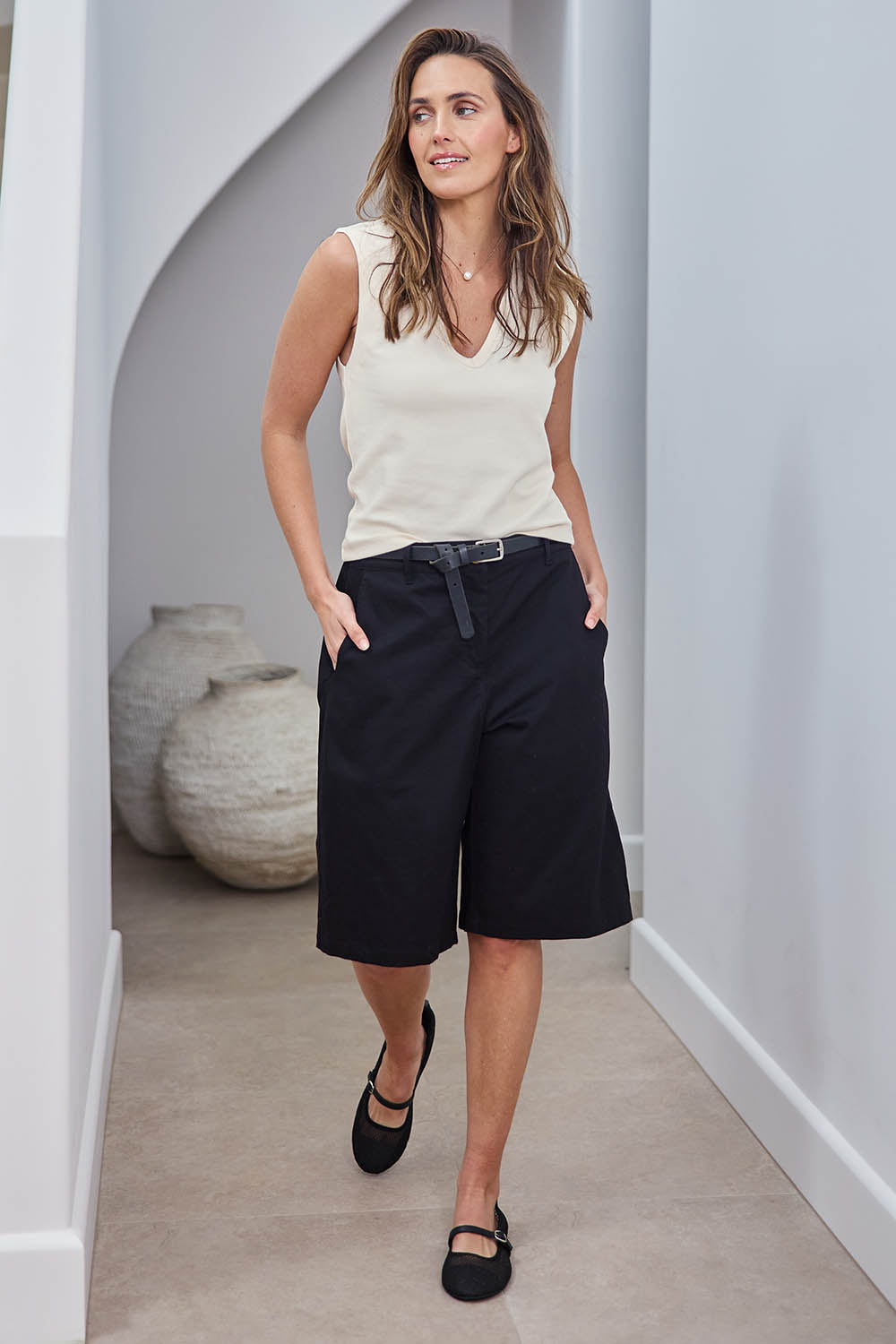 Model Tegand wearing size 10 of the Want You In My Life Long Line Shorts – Black in colour Black, from the front