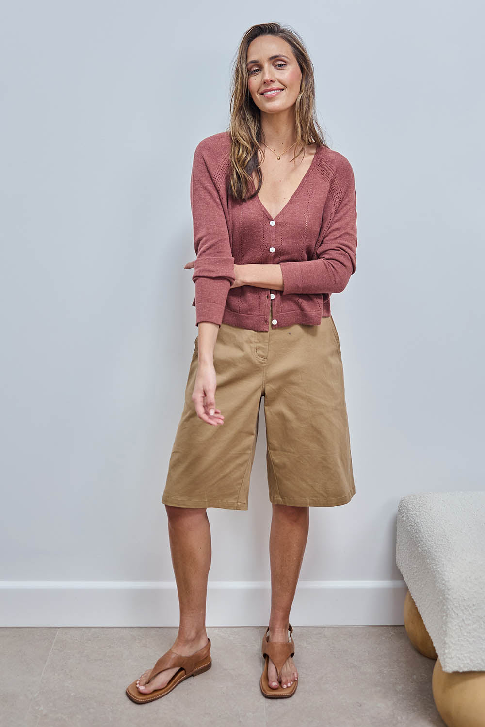 Model Tegand wearing size 10 of the Want You In My Life Long Line Shorts – Camel in colour Camel, from the front