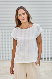 Model Tegand wearing size 10 of the Morning Light Cotton Top – White in colour White, in a cropped view